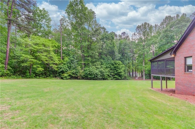 view of yard featuring a sunroom