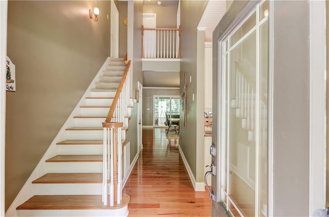 stairs with hardwood / wood-style floors