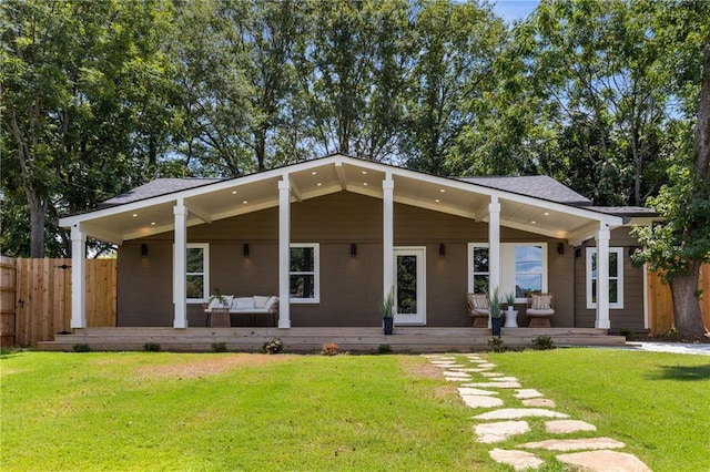 rear view of house with a lawn