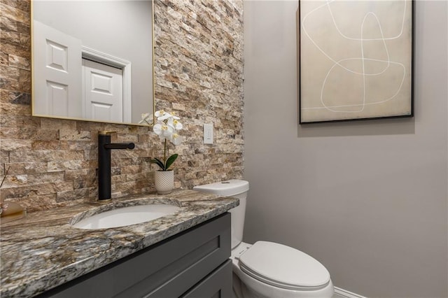 bathroom with toilet and vanity