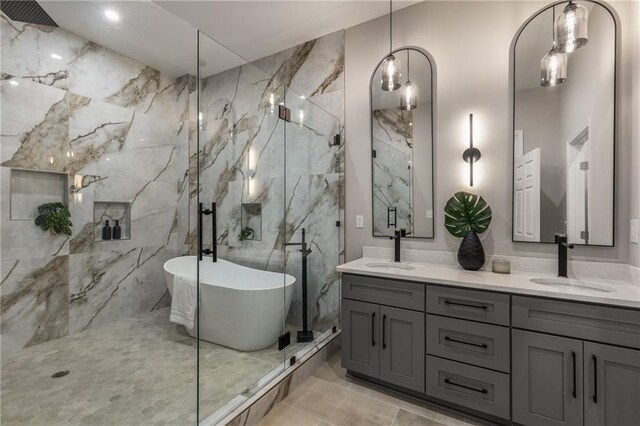 bathroom featuring separate shower and tub and vanity