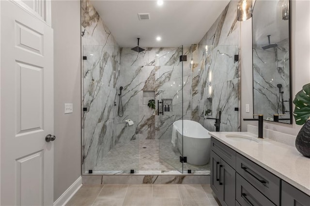 bathroom featuring separate shower and tub and vanity