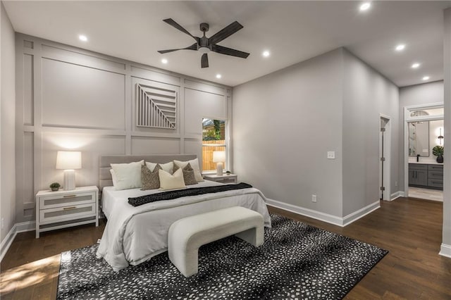 bedroom with ceiling fan, dark wood-type flooring, and connected bathroom