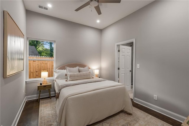 bedroom with hardwood / wood-style floors and ceiling fan