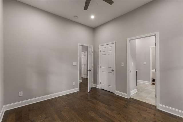 interior space featuring ceiling fan and dark hardwood / wood-style flooring