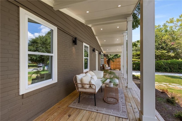 wooden terrace featuring covered porch