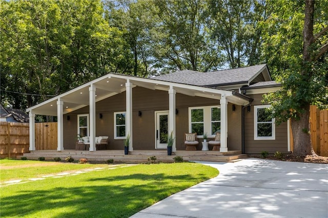 view of front of property with a porch and a front yard