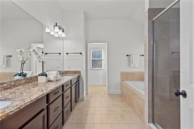 bathroom with tile patterned floors, vanity, and independent shower and bath