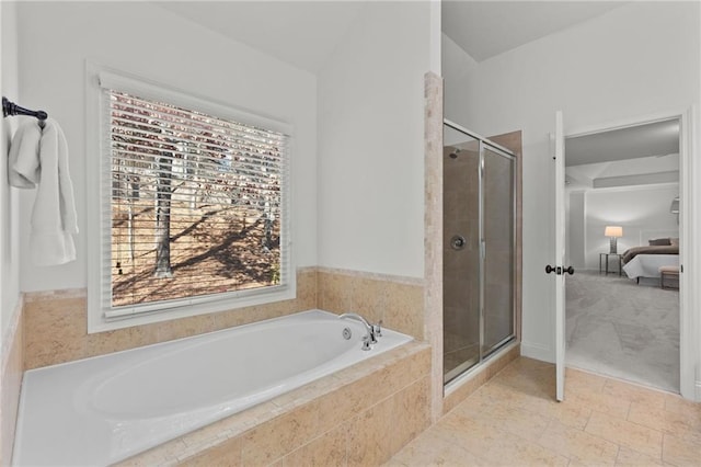 bathroom with separate shower and tub