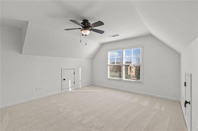 bonus room featuring vaulted ceiling, light colored carpet, and ceiling fan