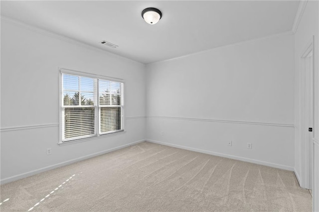 unfurnished room featuring light colored carpet and ornamental molding