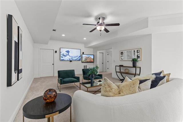 carpeted living room featuring ceiling fan