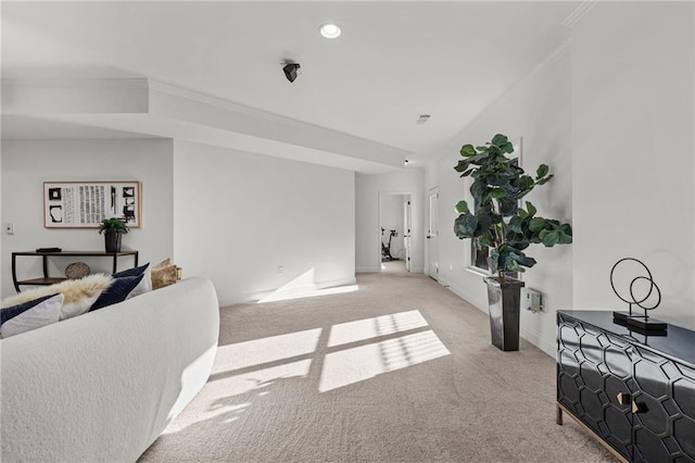 interior space featuring crown molding and light carpet