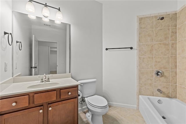 full bathroom with vanity, tiled shower / bath combo, tile patterned floors, and toilet