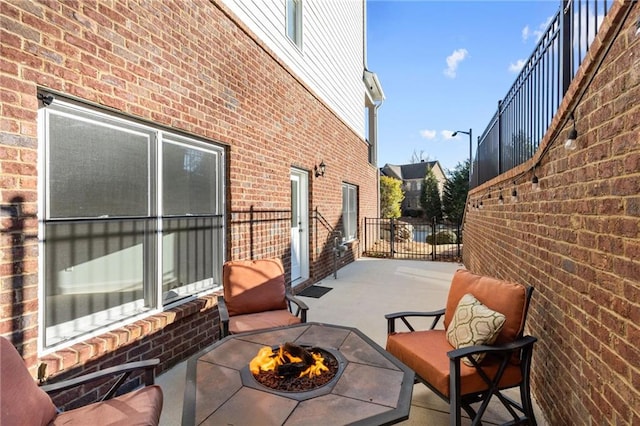 view of patio featuring an outdoor fire pit