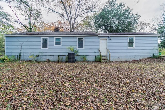 back of house featuring central AC