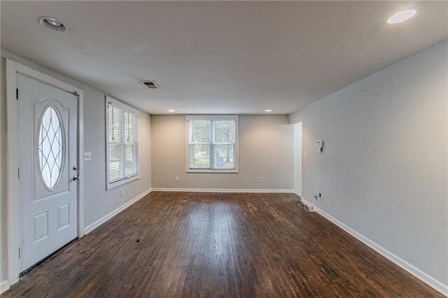 foyer entrance with dark hardwood / wood-style floors