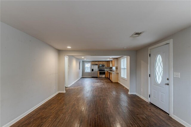 foyer entrance with dark hardwood / wood-style floors