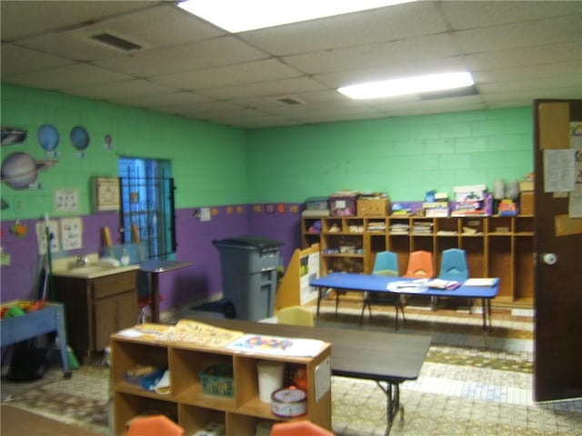 playroom featuring a drop ceiling