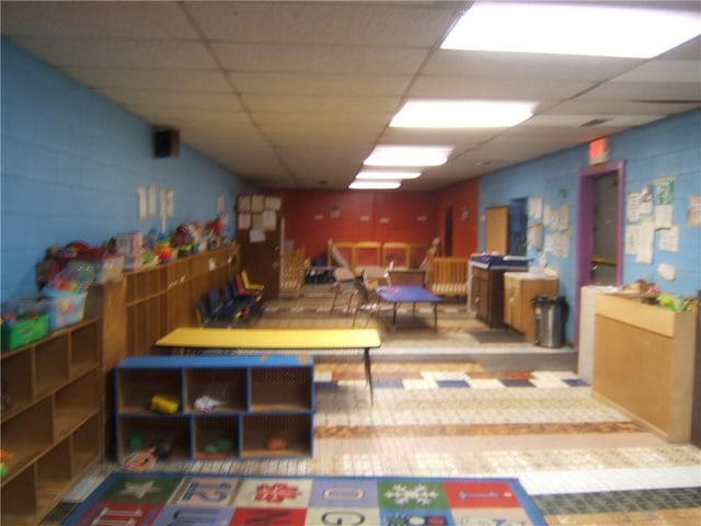 playroom featuring a drop ceiling