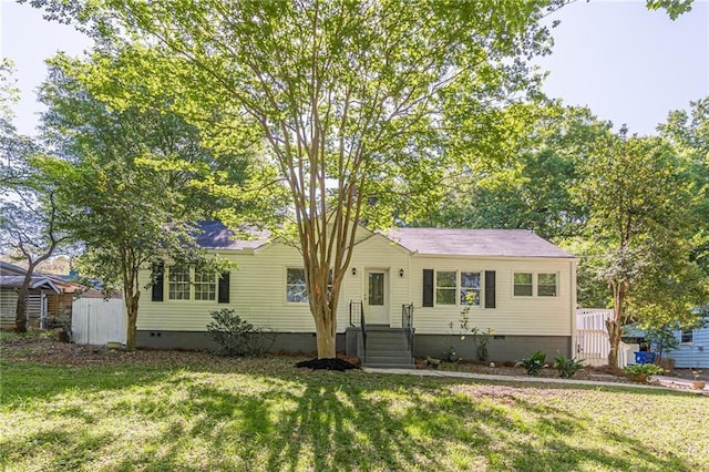 ranch-style home featuring crawl space and a front yard