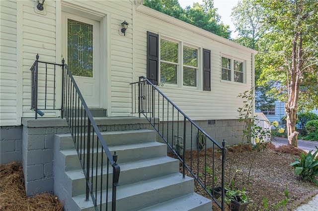 view of exterior entry with crawl space