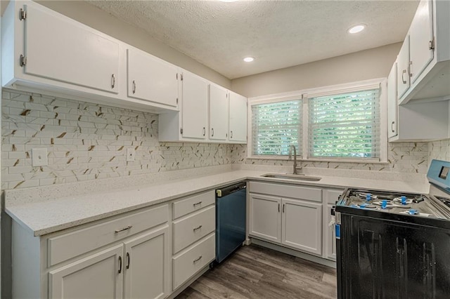 kitchen with white cabinets, range with electric cooktop, dishwasher, a sink, and a textured ceiling