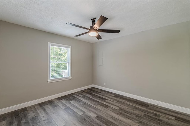 unfurnished room with dark wood finished floors, a textured ceiling, baseboards, and ceiling fan