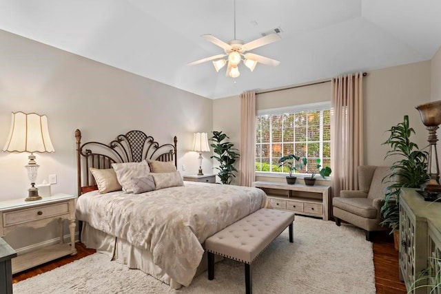 bedroom featuring wood-type flooring, lofted ceiling, and ceiling fan