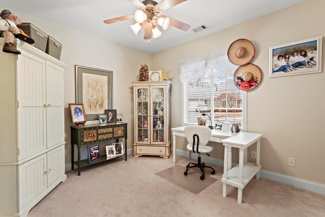 office area with ceiling fan and light carpet