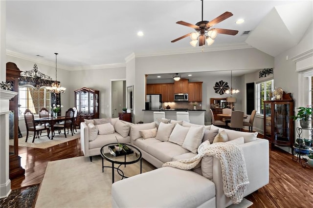 living room with crown molding, ceiling fan with notable chandelier, and dark hardwood / wood-style floors