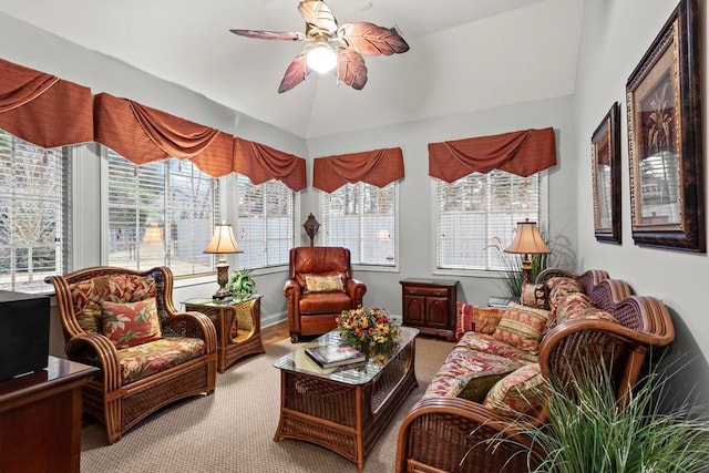 sunroom featuring ceiling fan, vaulted ceiling, and a wealth of natural light