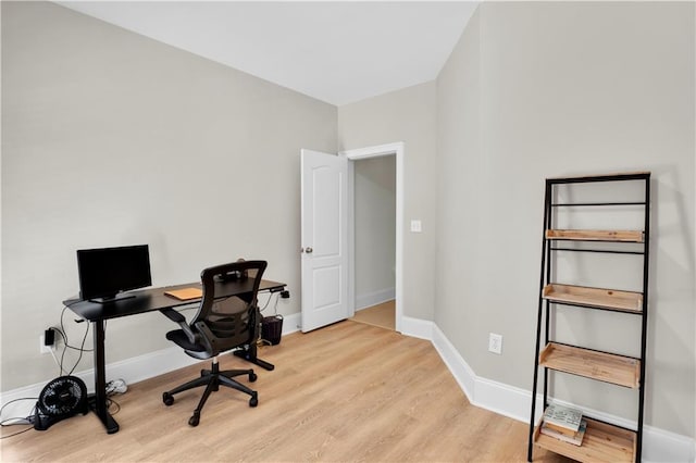 office featuring light wood-style floors and baseboards