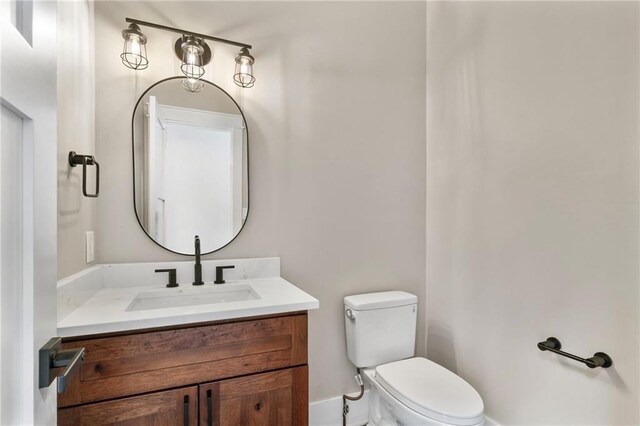 1066 Fairway Valley Dr, Woodstock, GA 30189 - bathroom featuring toilet, vanity, and baseboards