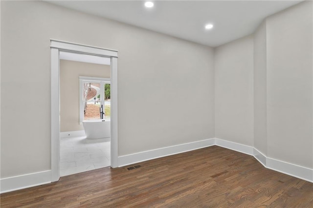 1066 Fairway Valley Dr, Woodstock, GA 30189 - spare room with dark wood-type flooring, baseboards, and recessed lighting