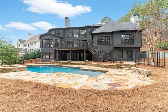 1066 Fairway Valley Dr, Woodstock, GA 30189 - rear view of house featuring stairs, a chimney, a wooden deck, and a fenced backyard