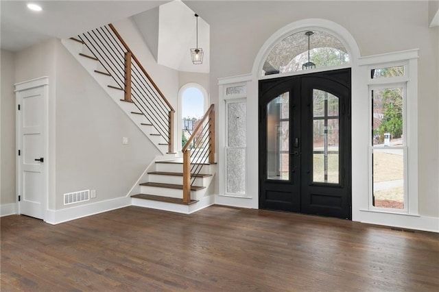 1066 Fairway Valley Dr, Woodstock, GA 30189 - entrance foyer with french doors, wood finished floors, stairs, baseboards, and recessed lighting