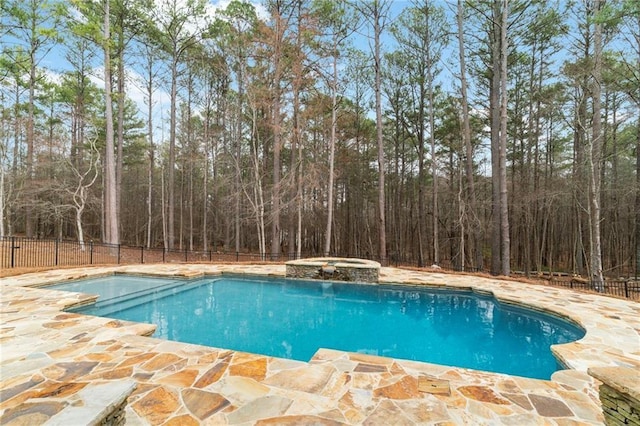 1066 Fairway Valley Dr, Woodstock, GA 30189 - view of swimming pool with fence, a patio, a pool with connected hot tub, and a view of trees