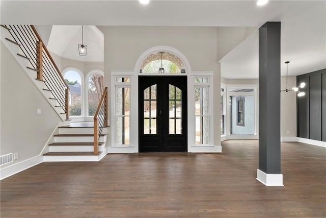 1066 Fairway Valley Dr, Woodstock, GA 30189 - entrance foyer with stairs, french doors, wood finished floors, baseboards, and a high ceiling