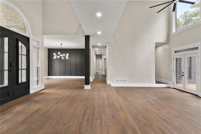 1066 Fairway Valley Dr, Woodstock, GA 30189 - foyer with french doors, a towering ceiling, wood finished floors, baseboards, and ceiling fan