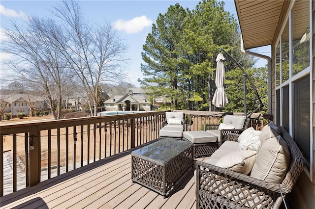 wooden terrace with a residential view and outdoor lounge area