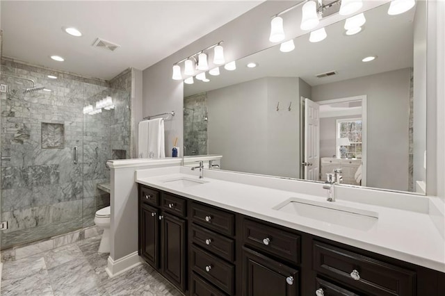 full bath featuring a sink, visible vents, toilet, and a shower stall