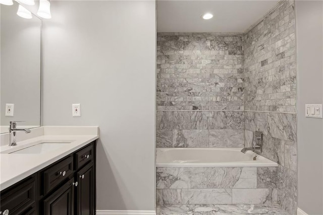bathroom with washtub / shower combination and vanity