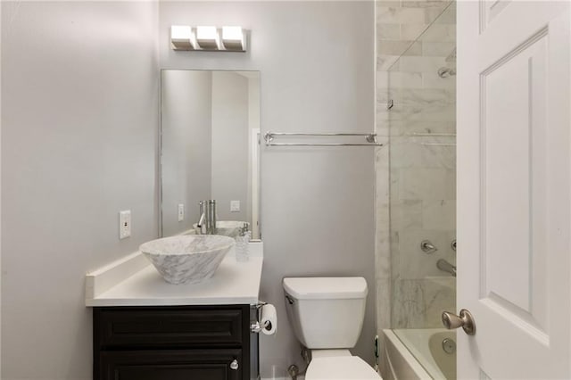 full bath featuring toilet, vanity, and shower / bath combination