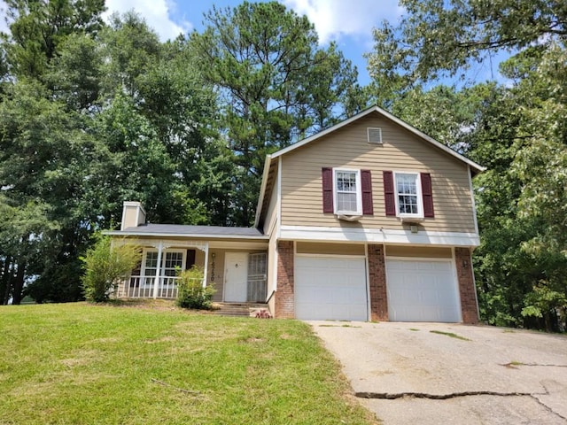 view of front facade with a garage, covered porch, and a front lawn