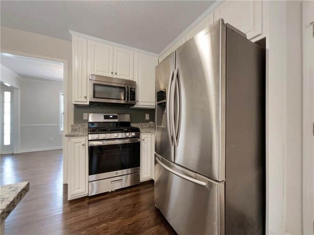 6001 Deer Springs Ln NW, Acworth, GA 30101 - kitchen featuring stainless steel appliances, white cabinets, dark wood-style floors, light stone counters, and ornamental molding