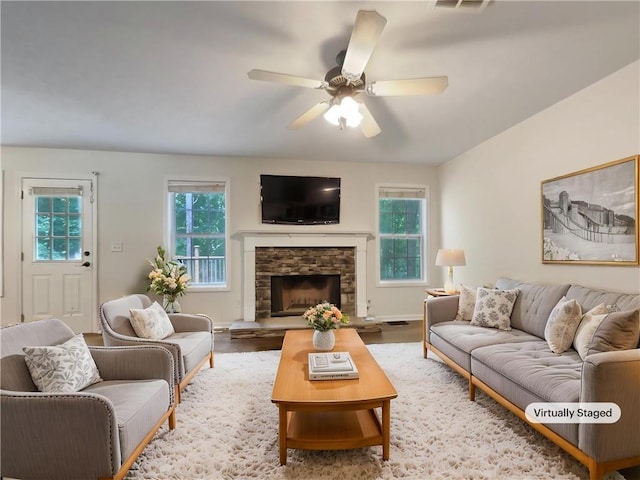 6001 Deer Springs Ln NW, Acworth, GA 30101 - living area featuring a ceiling fan, wood finished floors, and a stone fireplace