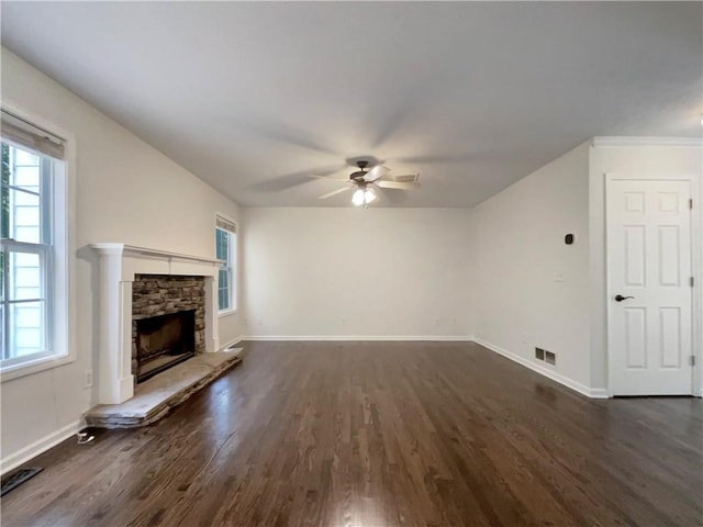 6001 Deer Springs Ln NW, Acworth, GA 30101 - unfurnished living room with dark wood-type flooring, a ceiling fan, plenty of natural light, and baseboards