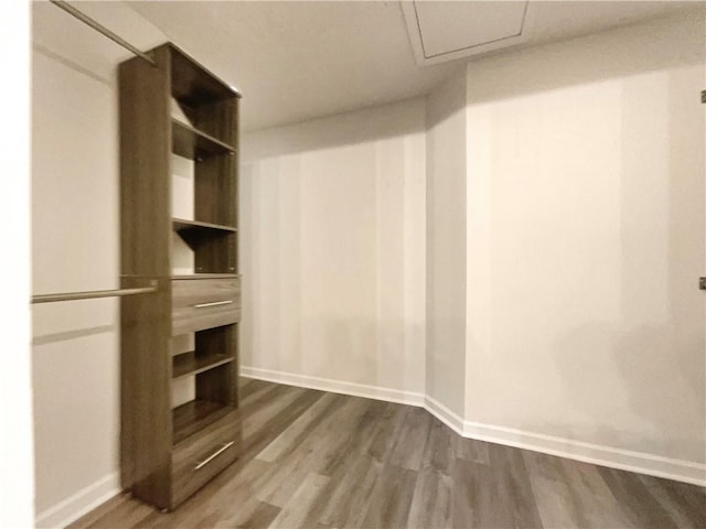 6001 Deer Springs Ln NW, Acworth, GA 30101 - walk in closet featuring dark wood finished floors and attic access
