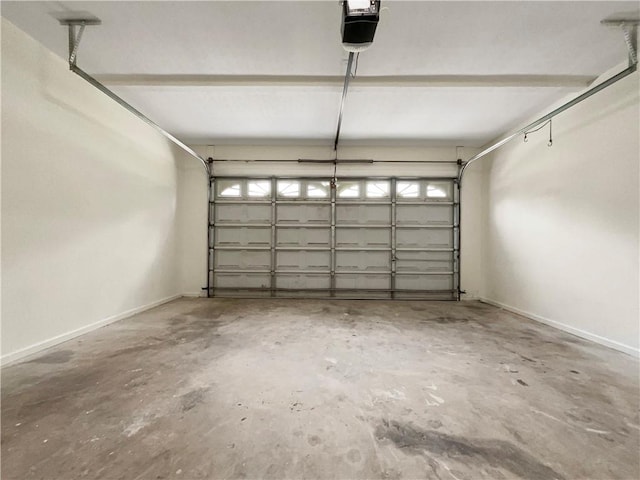 6001 Deer Springs Ln NW, Acworth, GA 30101 - garage featuring a garage door opener and baseboards